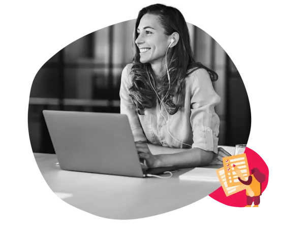 woman working on a laptop with headphones in a bright office, smiling professional surrounded by modern workspace elements