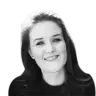 smiling woman with long hair in black and white, portrait of a woman with a friendly expression and dark clothing