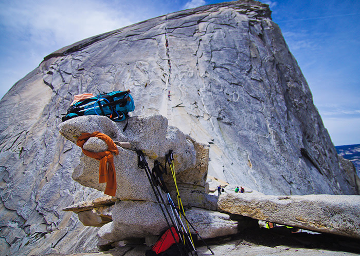 Half Dome Boulder with gear in front of Half Dome in Yosemite National Park