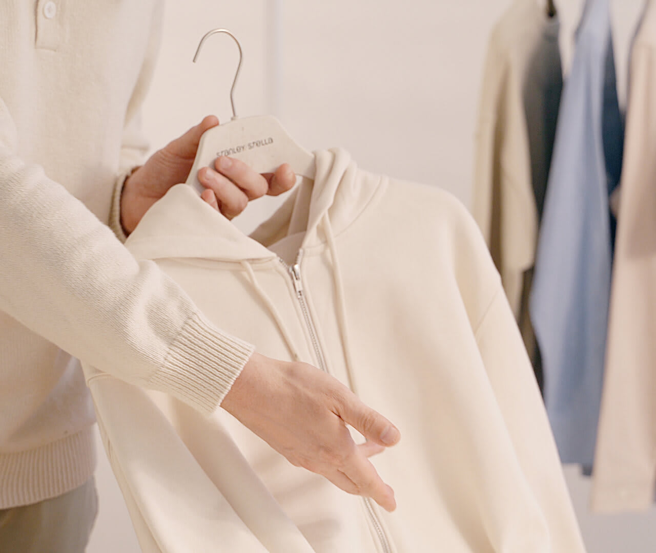 Person holding a Stanley/Stella hoodie