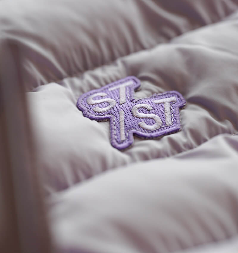 Premium Stanley/Stella embroidery with crisp definition on recycled nylon jacket