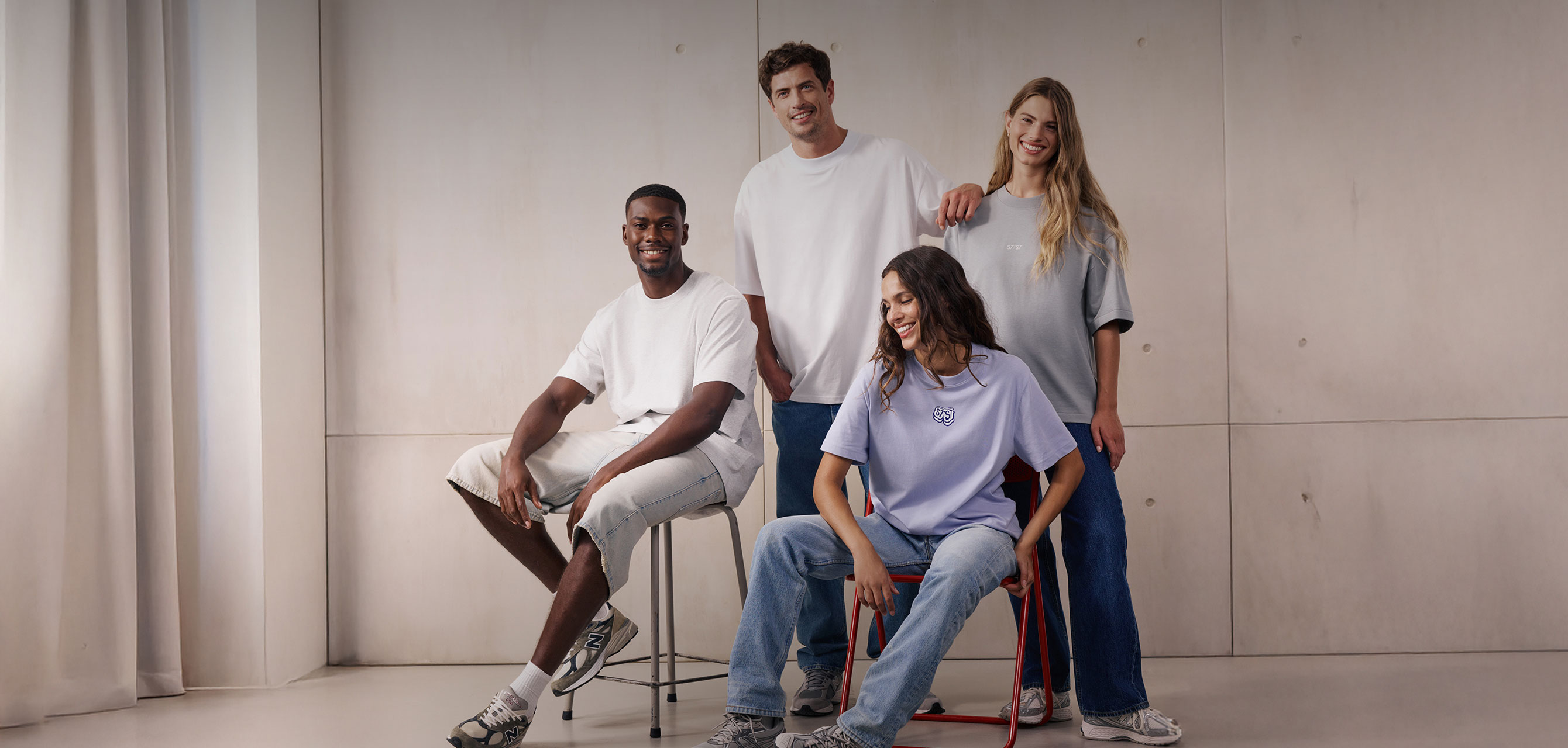 Models wearing new SS26 designs, including t-shirts and a Harper shirt