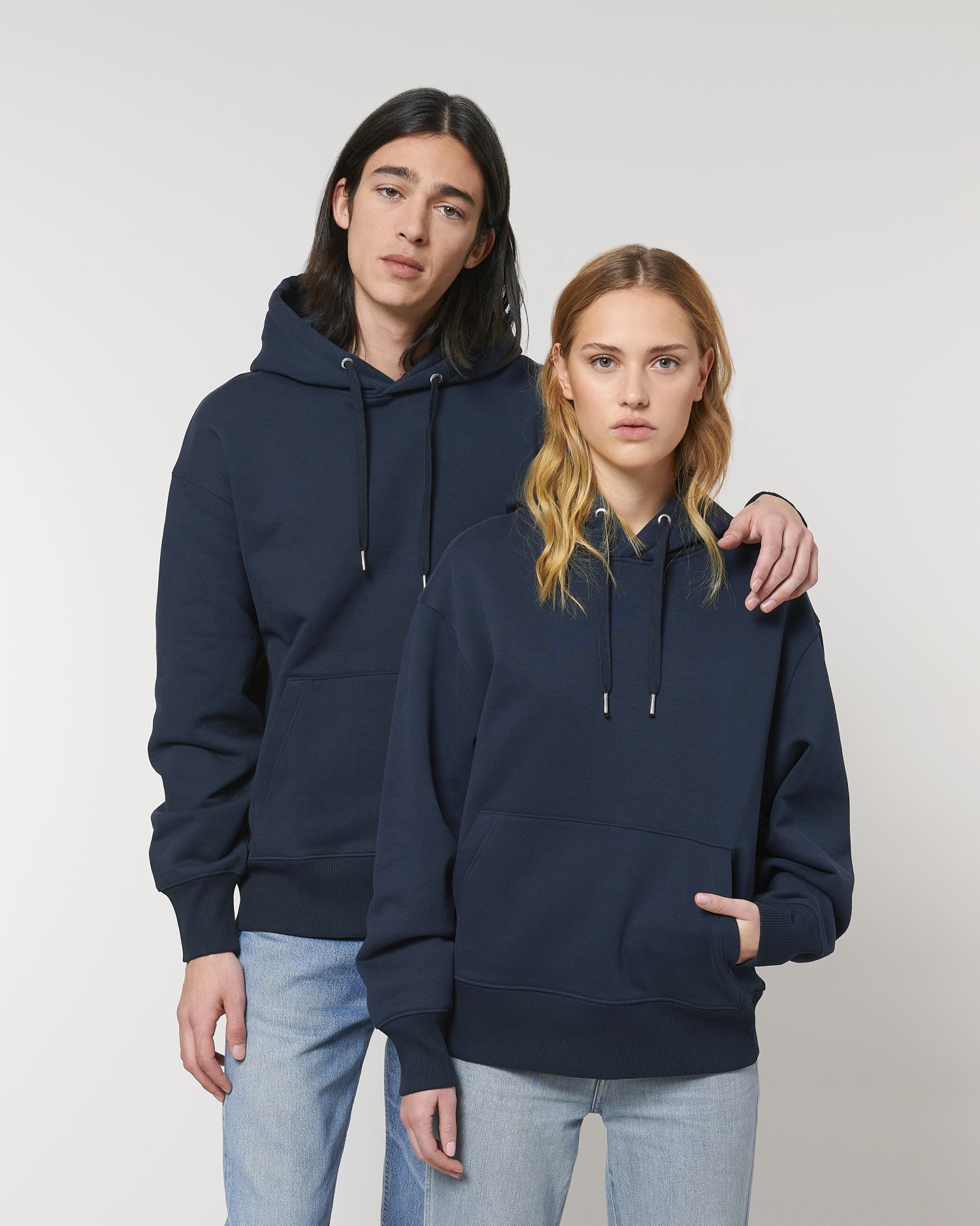 Duo wearing The unisex heavy relaxed hoodie sweatshirt