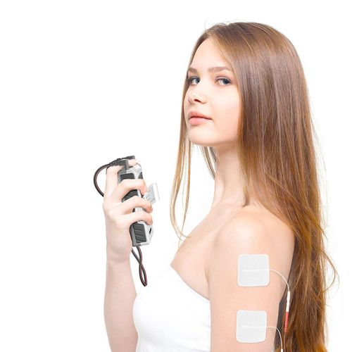 Tens & Muscle Stimulation machine with electrodes being used on a womans arm