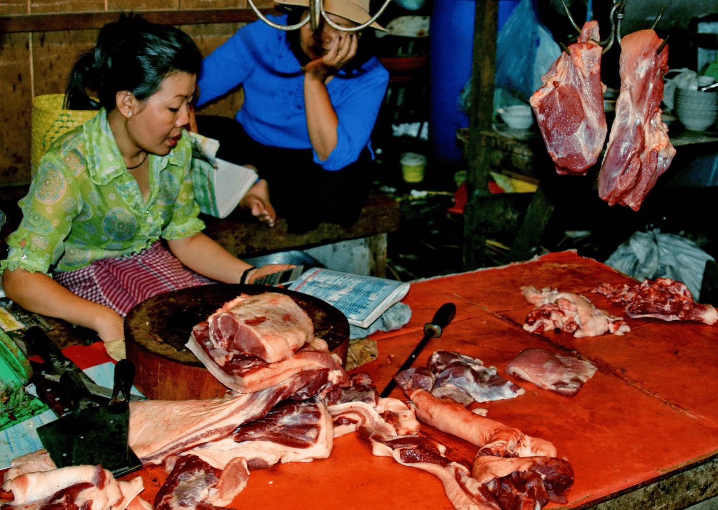 russian market photos - a vendor selling meat