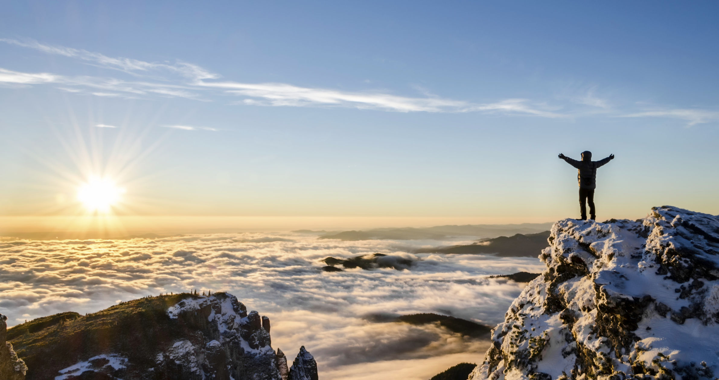 Sunrise over clouds at the top of a mountain
