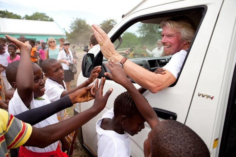 Hi-fiving children in South Africa