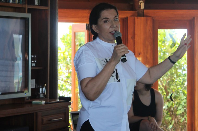 Marina speaking to the gathering
