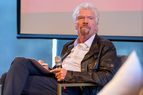Richard Branson taking notes