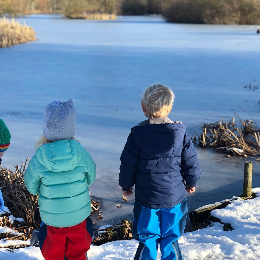 Etta and Artie standing by a frozen lake Etta and Artie standing by a frozen lake