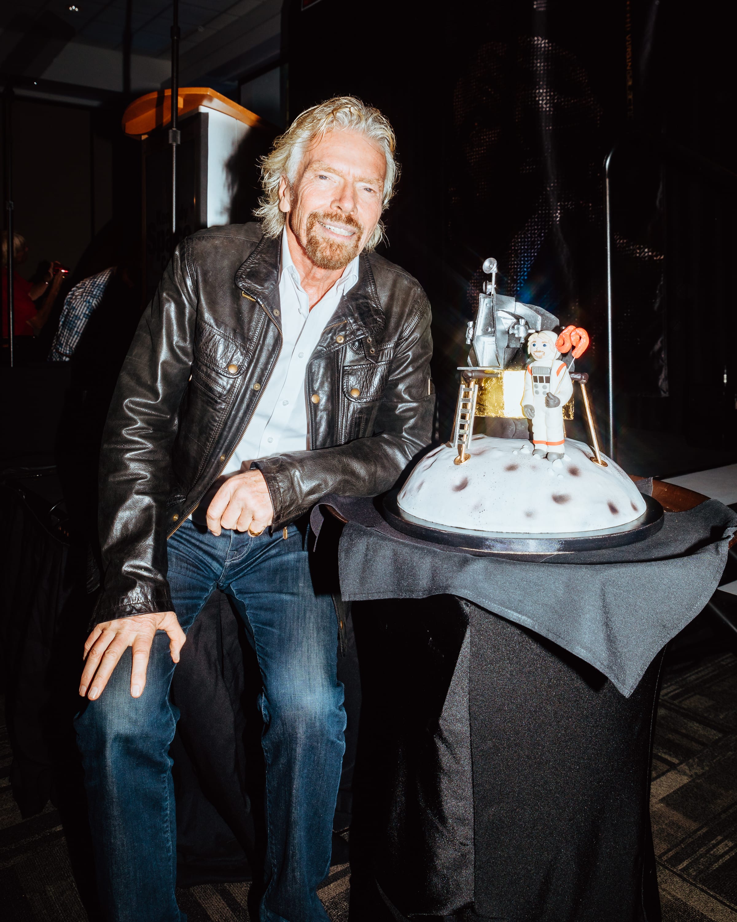 Richard Branson and his moon landing themed birthday cake Richard Branson and his moon landing themed birthday cake