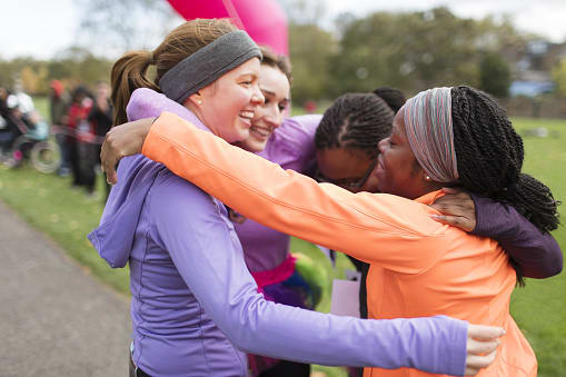 Runners hugging Runners hugging