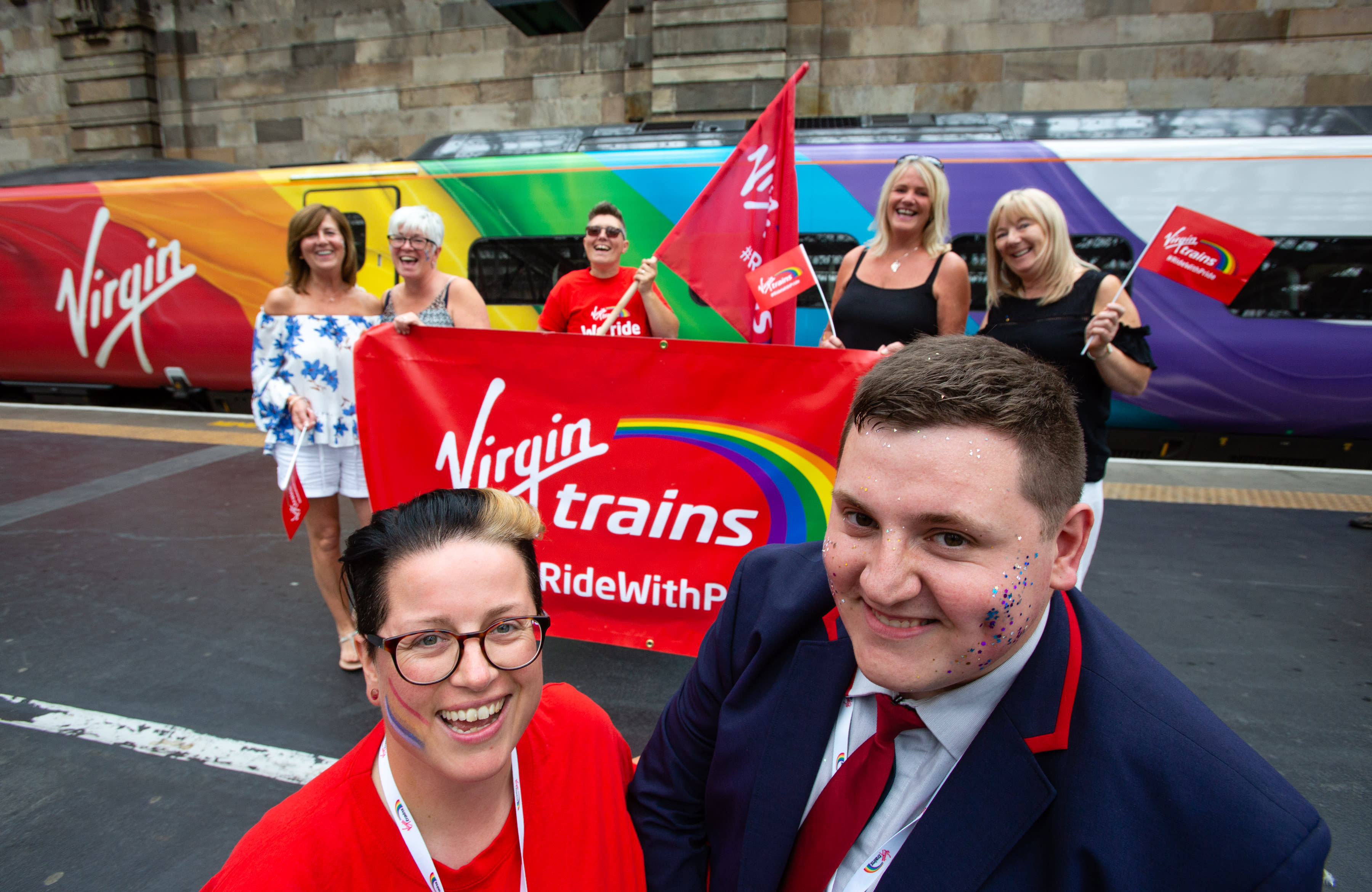 Vic Whitehouse poses with colleagues in front of Virgin Trains' rainbow coloured Pride Train Vic Whitehouse poses with colleagues in front of Virgin Trains' rainbow coloured Pride Train