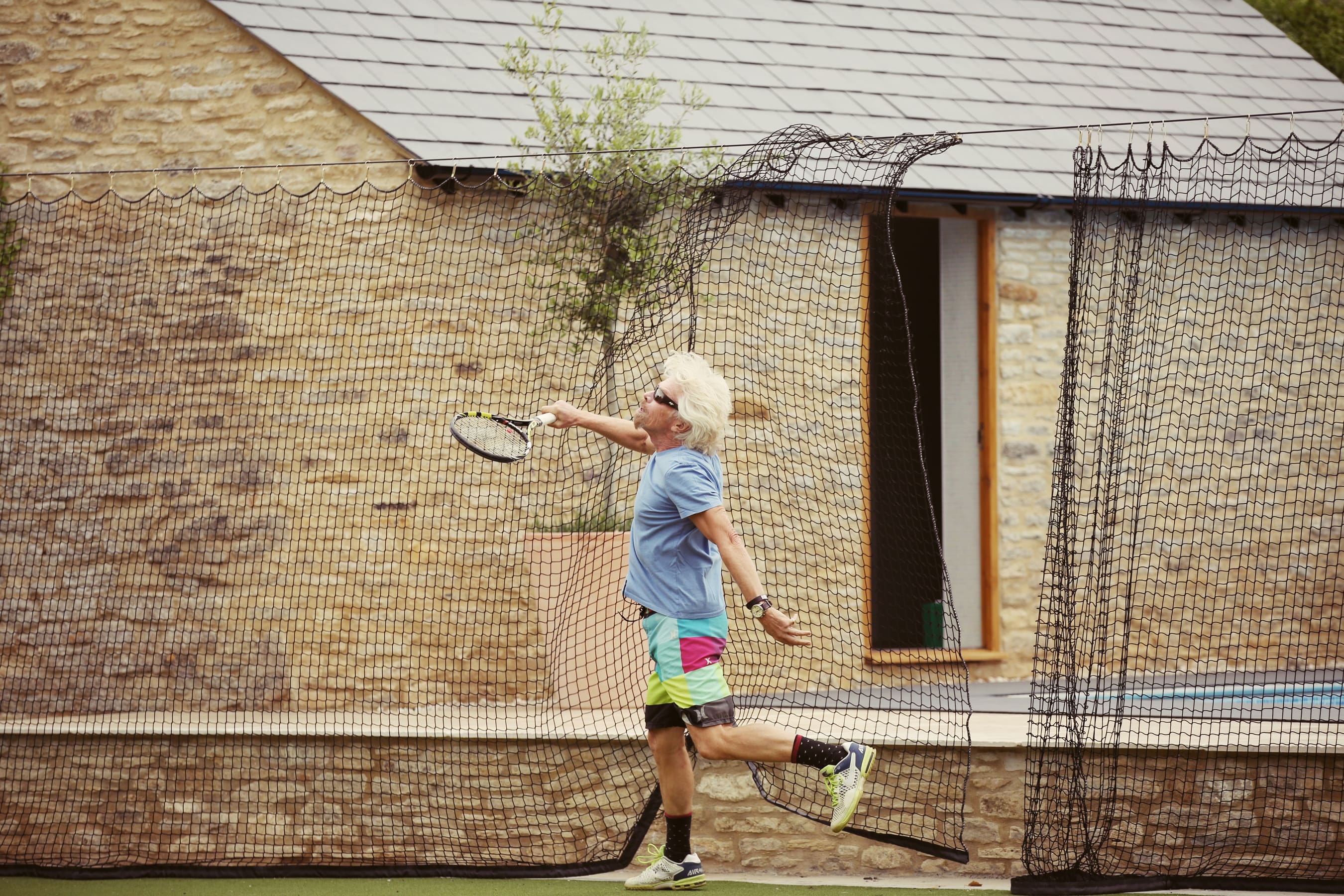 Richard Branson playing tennis in oxford Richard Branson playing tennis in oxford