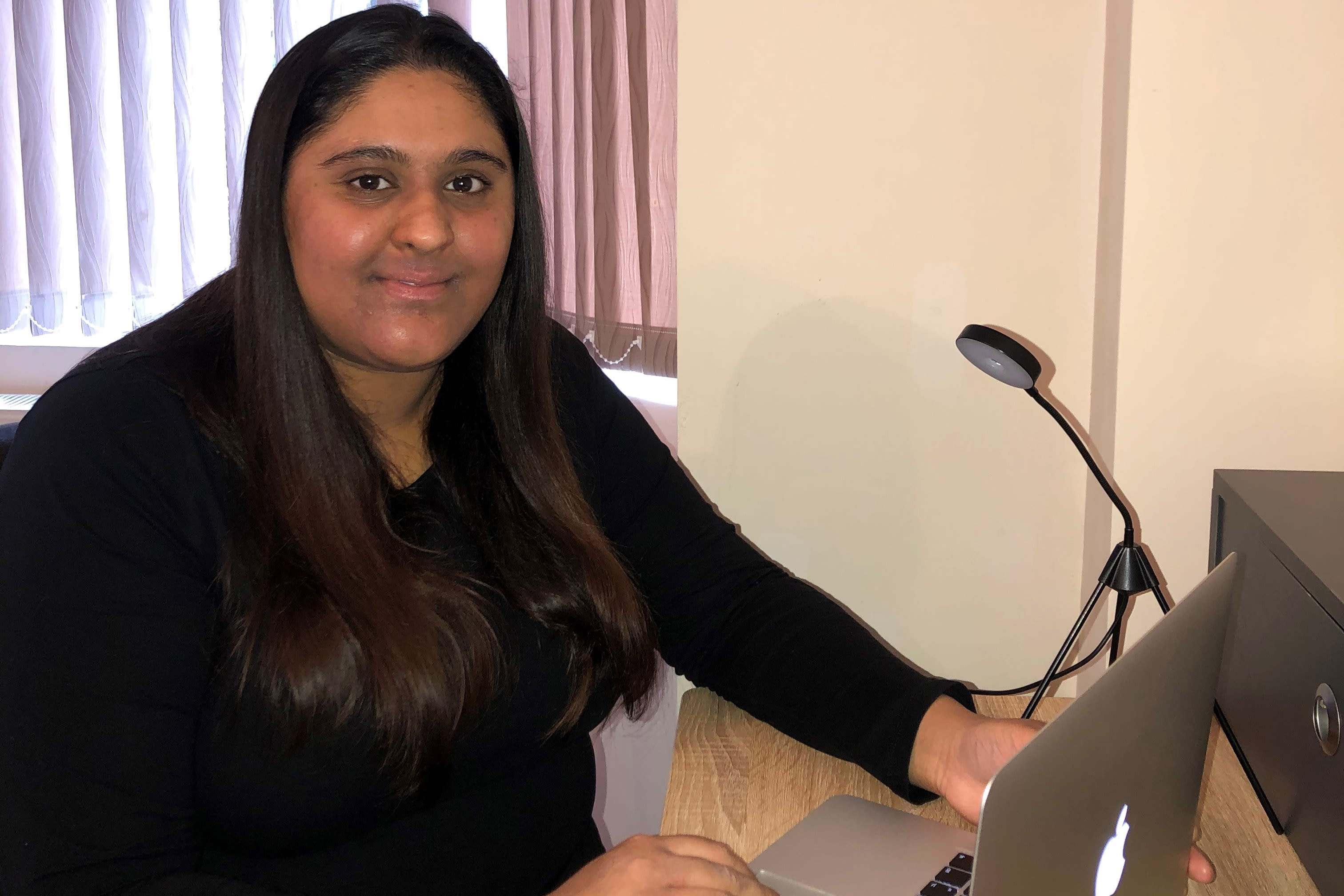 Romi Dhillon, a student nurse, completing placement assessments online Romi Dhillon, a student nurse, completing placement assessments online