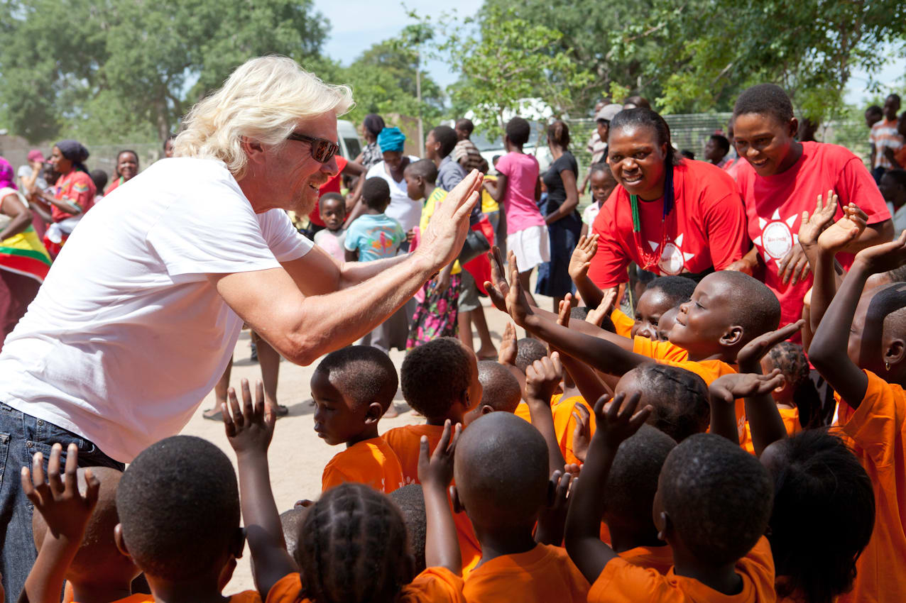 Richard Branson high five children in South Africa with Virgin Unite Richard Branson high five children in South Africa with Virgin Unite