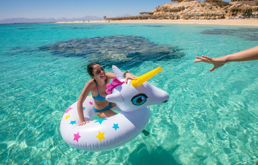 Sandy beach beside clear turquoise Red Sea water Sandy beach beside clear turquoise Red Sea water