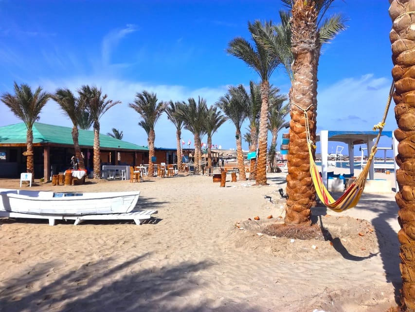 Sandy beach beside clear turquoise Red Sea water Sandy beach beside clear turquoise Red Sea water
