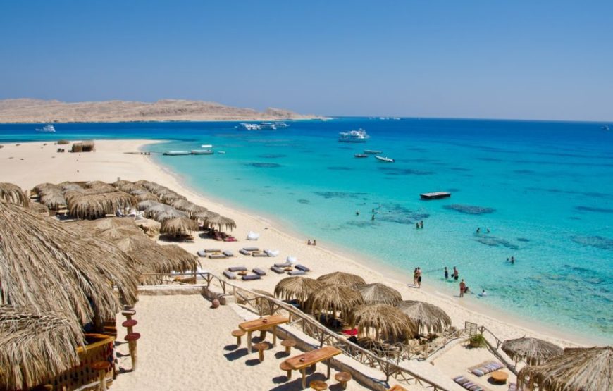 Sandy beach beside clear turquoise Red Sea water Sandy beach beside clear turquoise Red Sea water