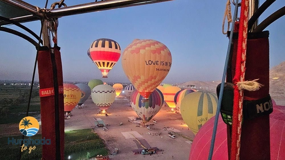 Hot-air balloons flying or preparing to launch over the Nile Valley landscape Hot-air balloons over the Nile Valley at sunrise — Practical choices to consider