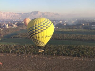 Hot-air balloons flying or preparing to launch over the Nile Valley landscape Hot-air balloons over the Nile Valley at sunrise — Questions travellers ask