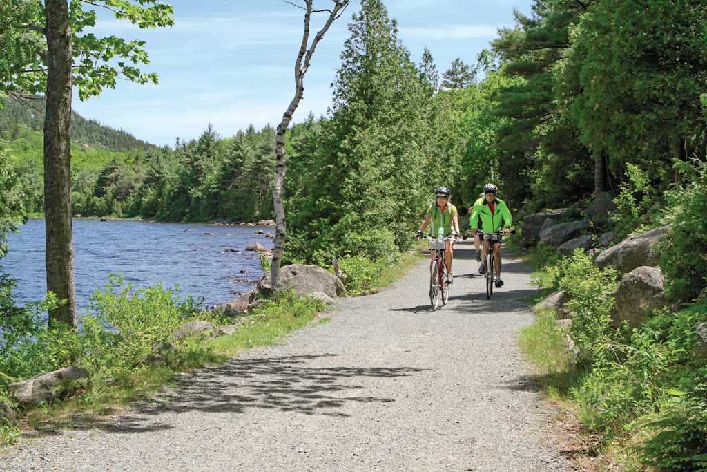 Two guests biking along the carriage trails in Acadia National Park