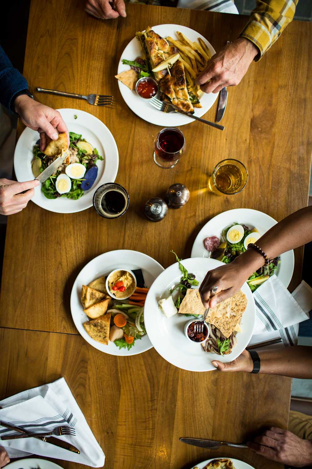 VBT Fall 2019 Photoshoot Close-up of guests sharing food at Topnotch Resort in Stowe by JAM Creative