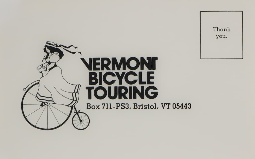 The image depicts a Vermont Bicycle Touring logo featuring a silhouette of a person riding a bicycle, along with the company's address and a "Thank you" message.