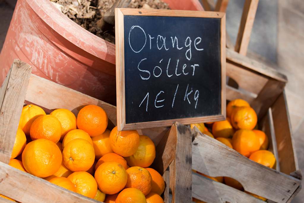 "he town of Soller stands in what is known as aEThe Golden Valleyaa in the north west of Majorca, an area rich in orange and lemon groves. Buying oranges or lemons are almost given away. 1 Euro will buy a kilogram of freshly picked juicy oranges."