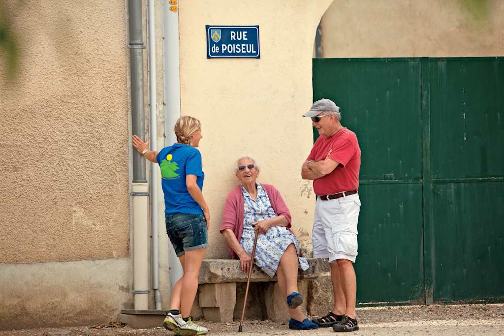 Passengers talking to a local in France Passengers talking to a local in France