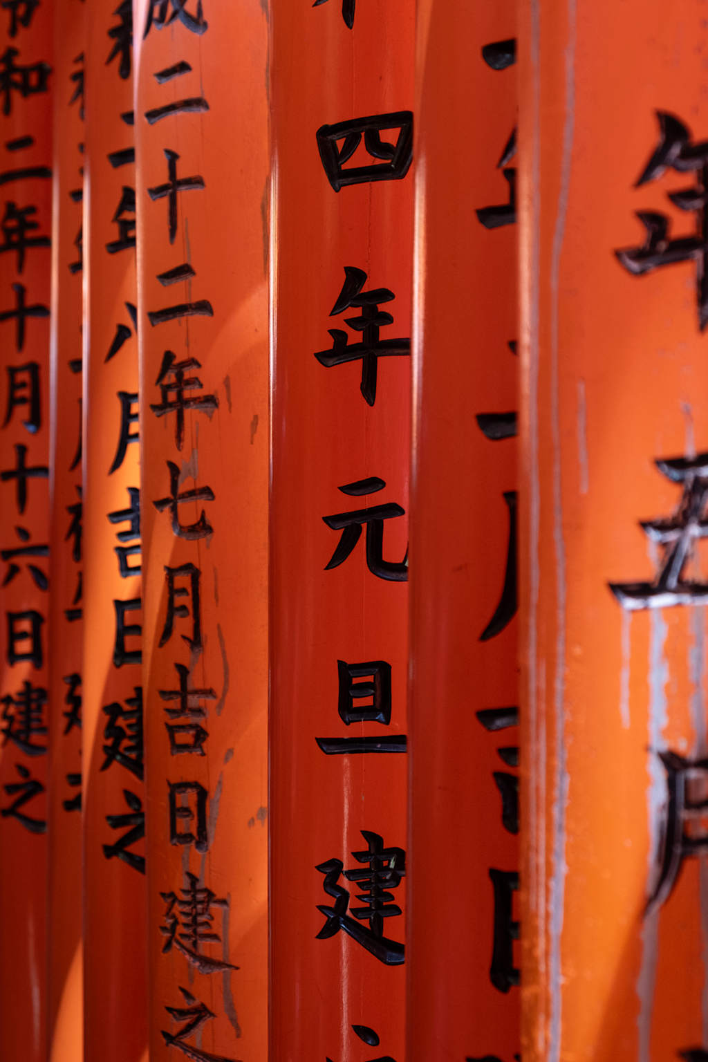 The image depicts numerous red lanterns with Chinese characters written on them, creating a vibrant and festive atmosphere.