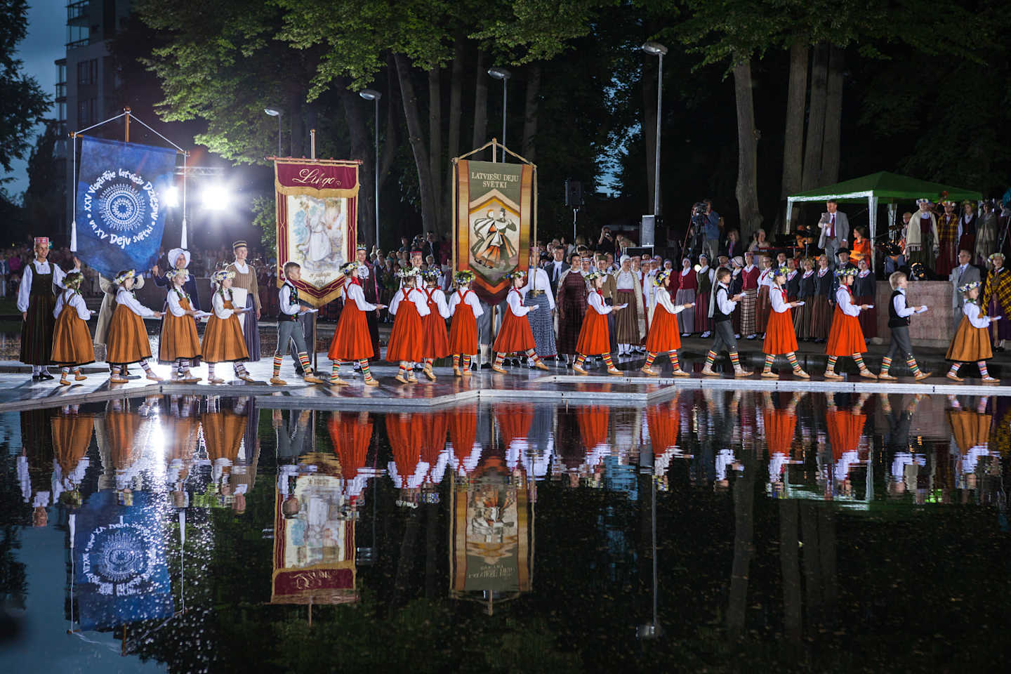 The Latvian National Song and Dance Festival, BAB Riga, Latvia – June 30, 2013: The Latvian National Song and Dance Festival. Official opening of the Song and Dance Celebration and honouring of the senior conductors and producers in Song Festival park Viesturdarzs. The opening ceremony with the participation of children
