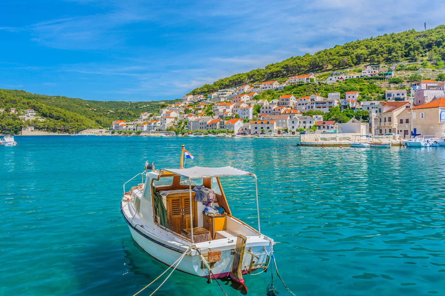Waterfront view at small picturesque town Pucisca, Island of Brac, Croatia summertime.