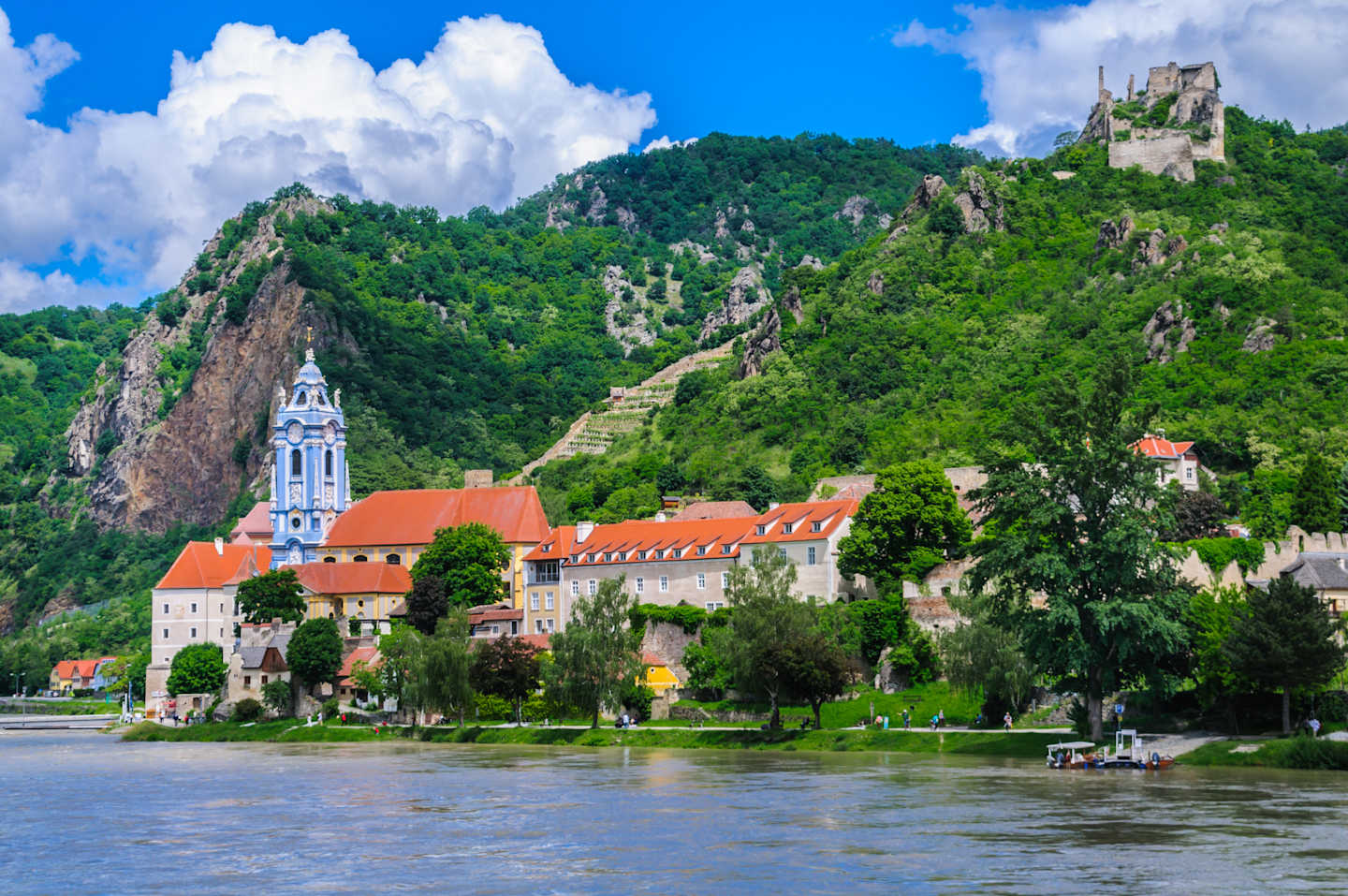 The beautiful blue and white clock tower of the Durnstein Abbey along the Danube River in lower Austria.