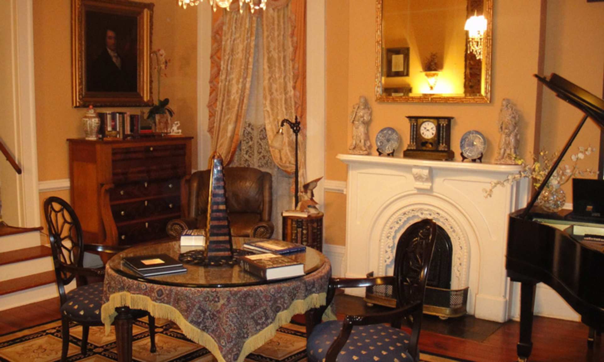 A cozy and ornate interior with a fireplace, antique furniture, and decorative items, creating a warm and inviting atmosphere.