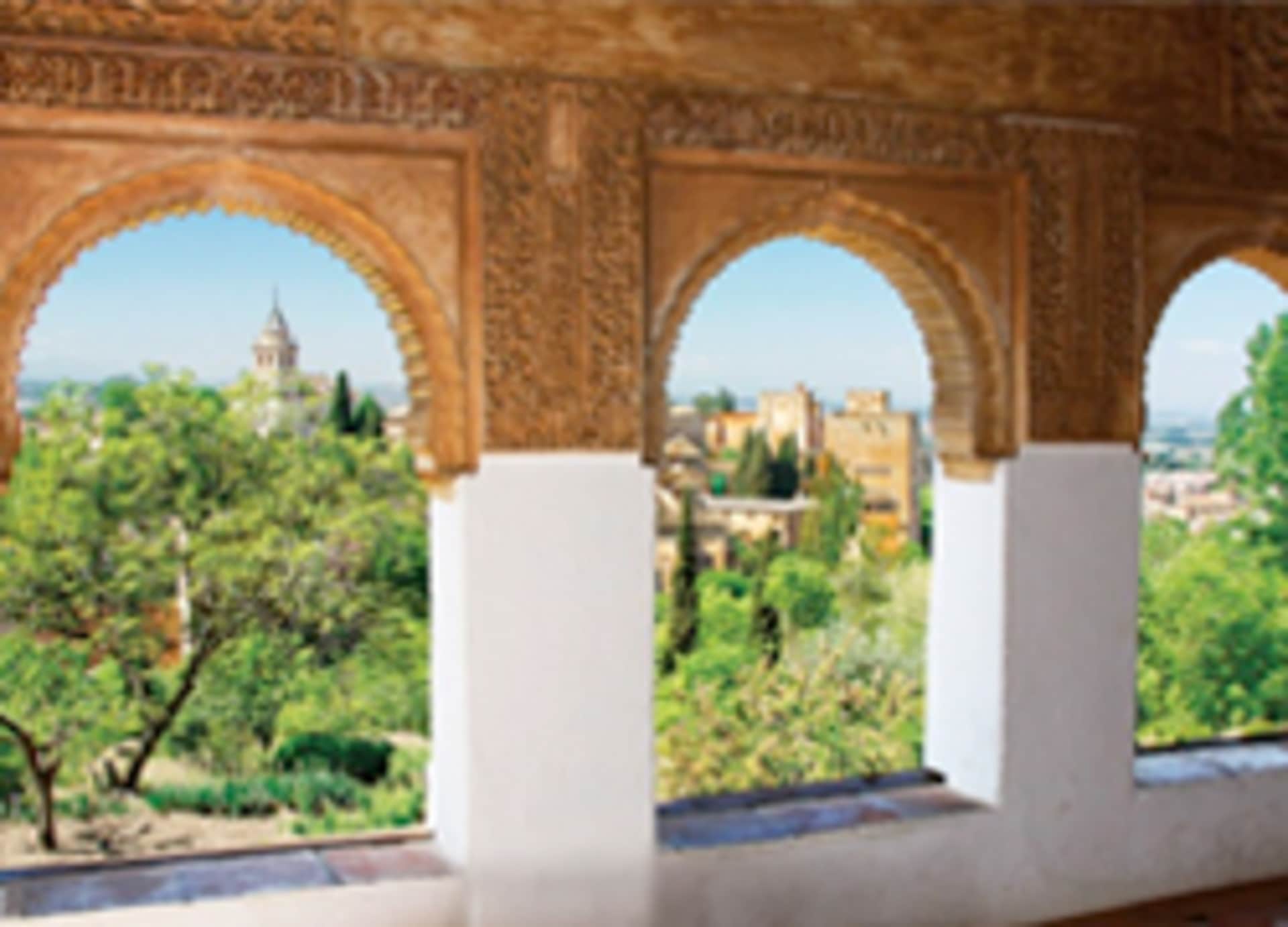 The image depicts an ornate archway with intricate carvings, framing a lush, verdant landscape in the background, featuring a city skyline with towers and domes.