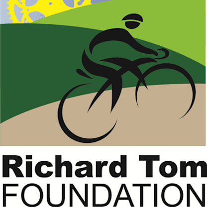 A stylized illustration of a cyclist riding on a road against a backdrop of green hills and a yellow sky.