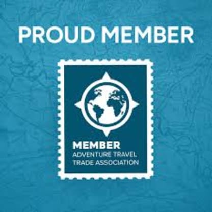 The image depicts a world map enclosed within a compass-like design, with the text "MEMBER ADVENTURE TRAVEL TRADE ASSOCIATION" displayed below.