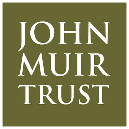 The image displays the text "JOHN MUIR TRUST" against a solid olive green background.