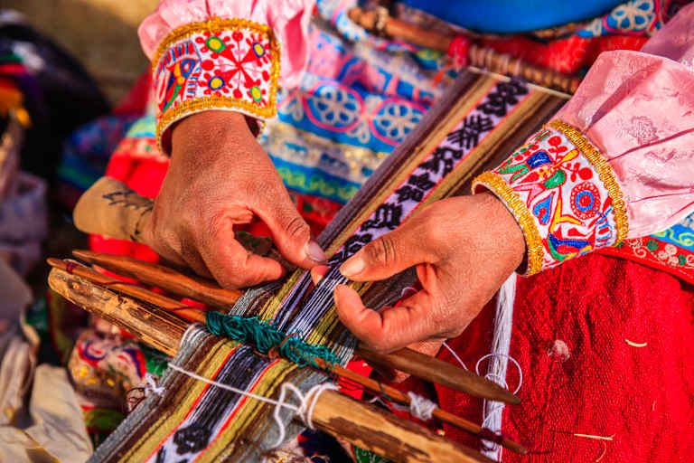 Vibrant, intricately patterned textiles and hands skillfully weaving them, showcasing the rich cultural heritage and craftsmanship.