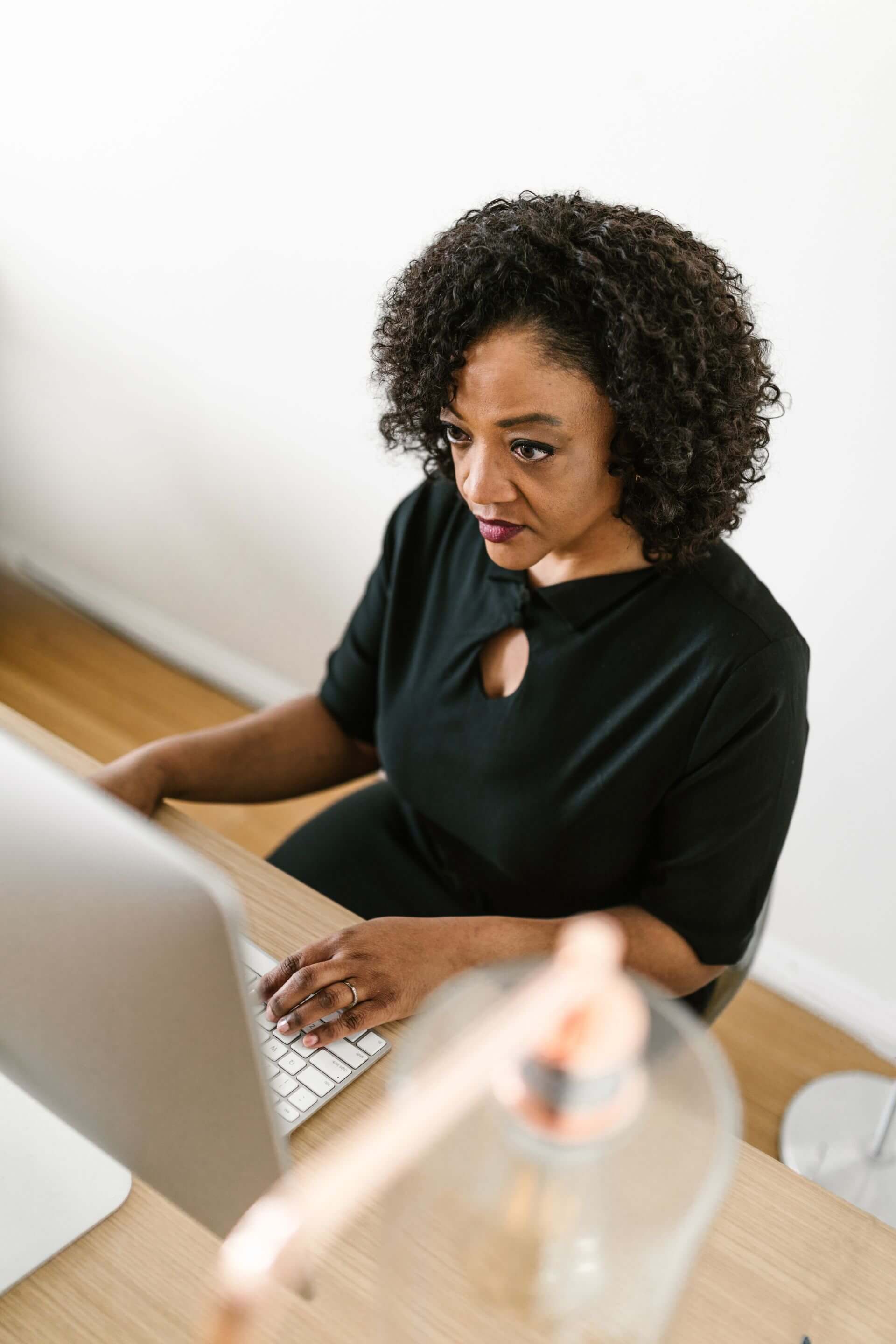 An employee focused at her desk