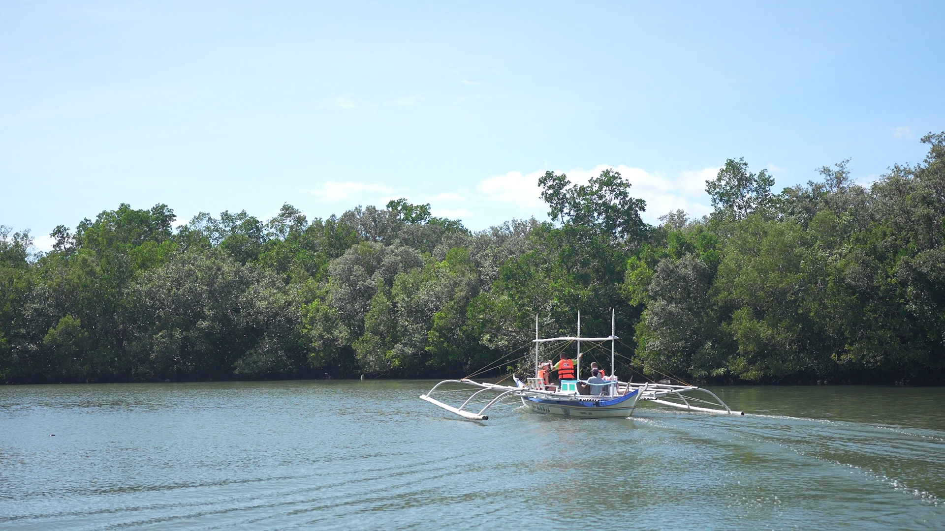 Visitors enjoying kayaking and river cruising in Donsol