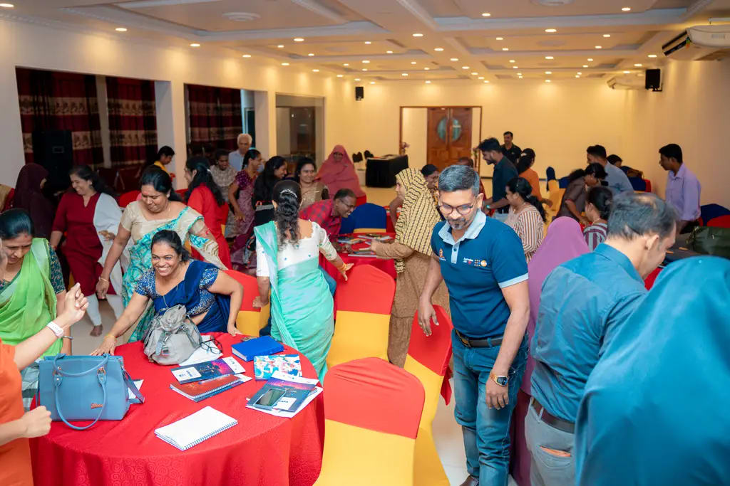 Participants moving between tables, cyber equity workshop, DreamSpace Academy Batticaloa, October 2024.