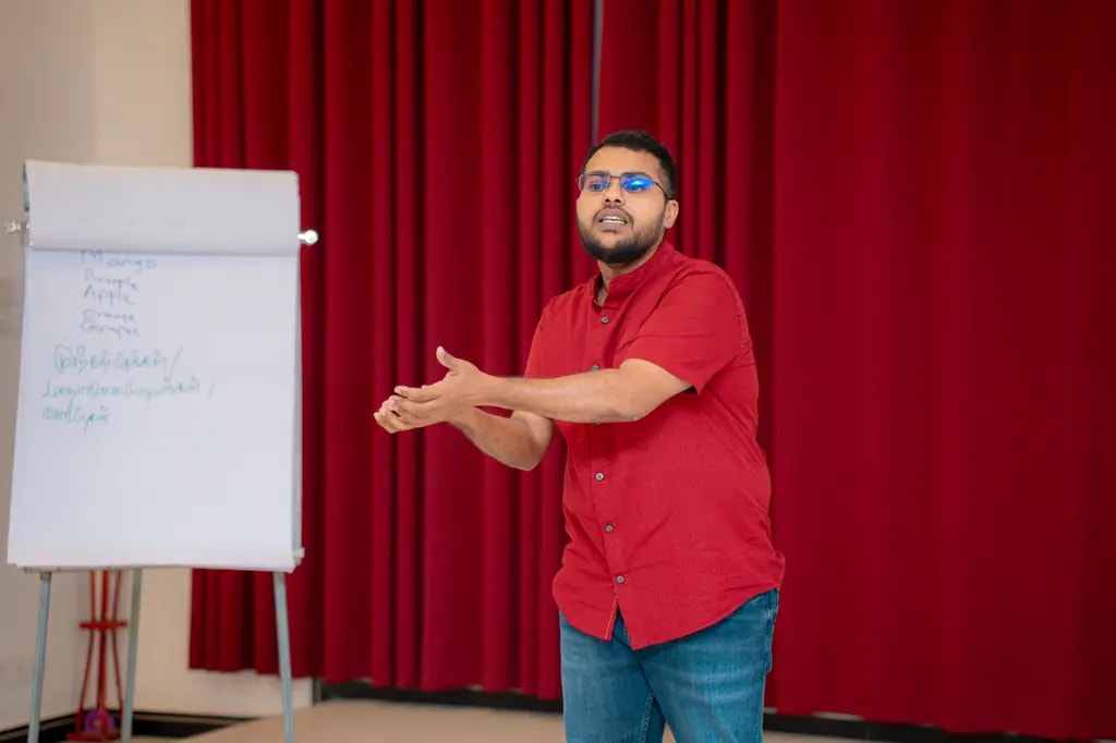 A trainer speaking, cyber equity workshop, DreamSpace Academy Batticaloa, October 2024.