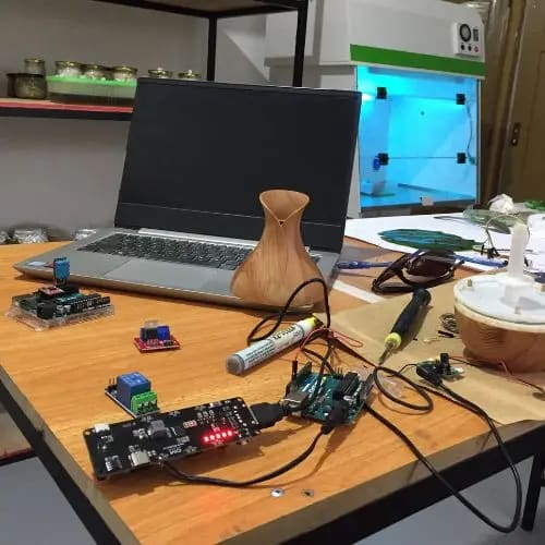 Building the Fluffynator, an automated humidifier for the growth chamber, July 2022. Photo: Dinacon 2022.