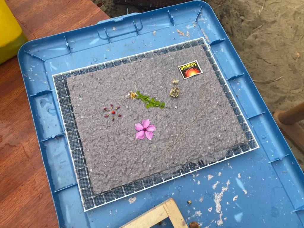 A sheet of paper with flowers pressed into it, July 2022. Photo: Dinacon 2022.