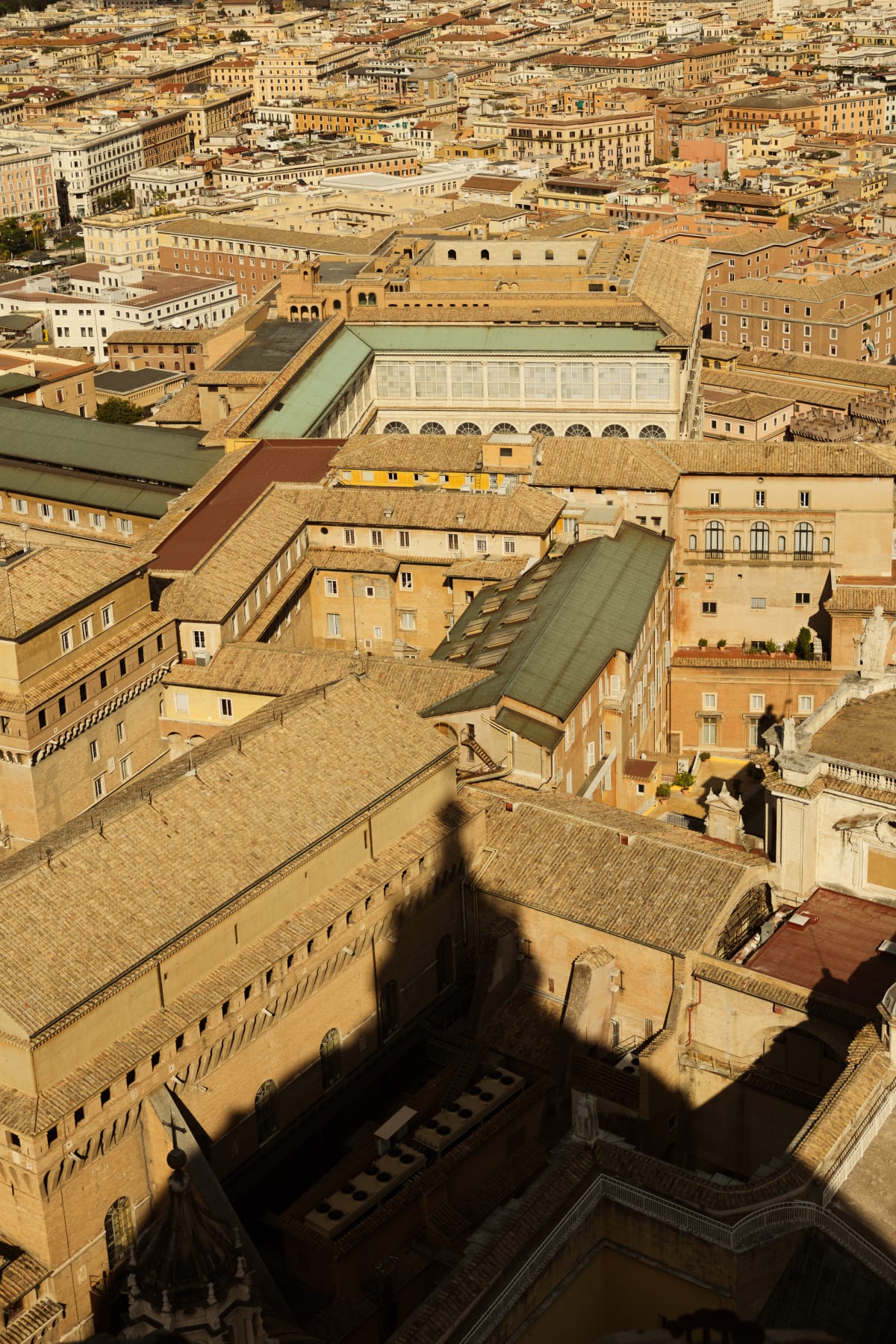 Sunlit ochre rooftops and courtyards seen from above