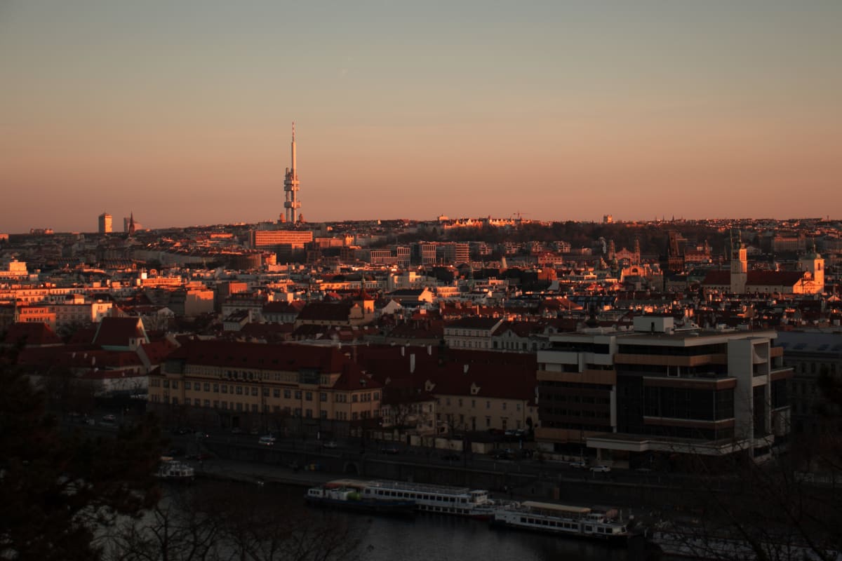 Prague's skyline glowing orange in the final evening light