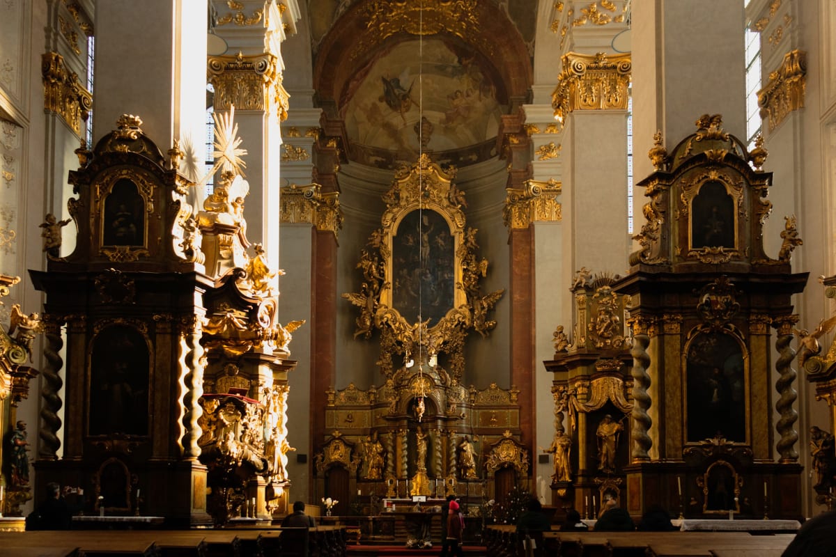 A richly ornamented Baroque altar glowing in sunlight
