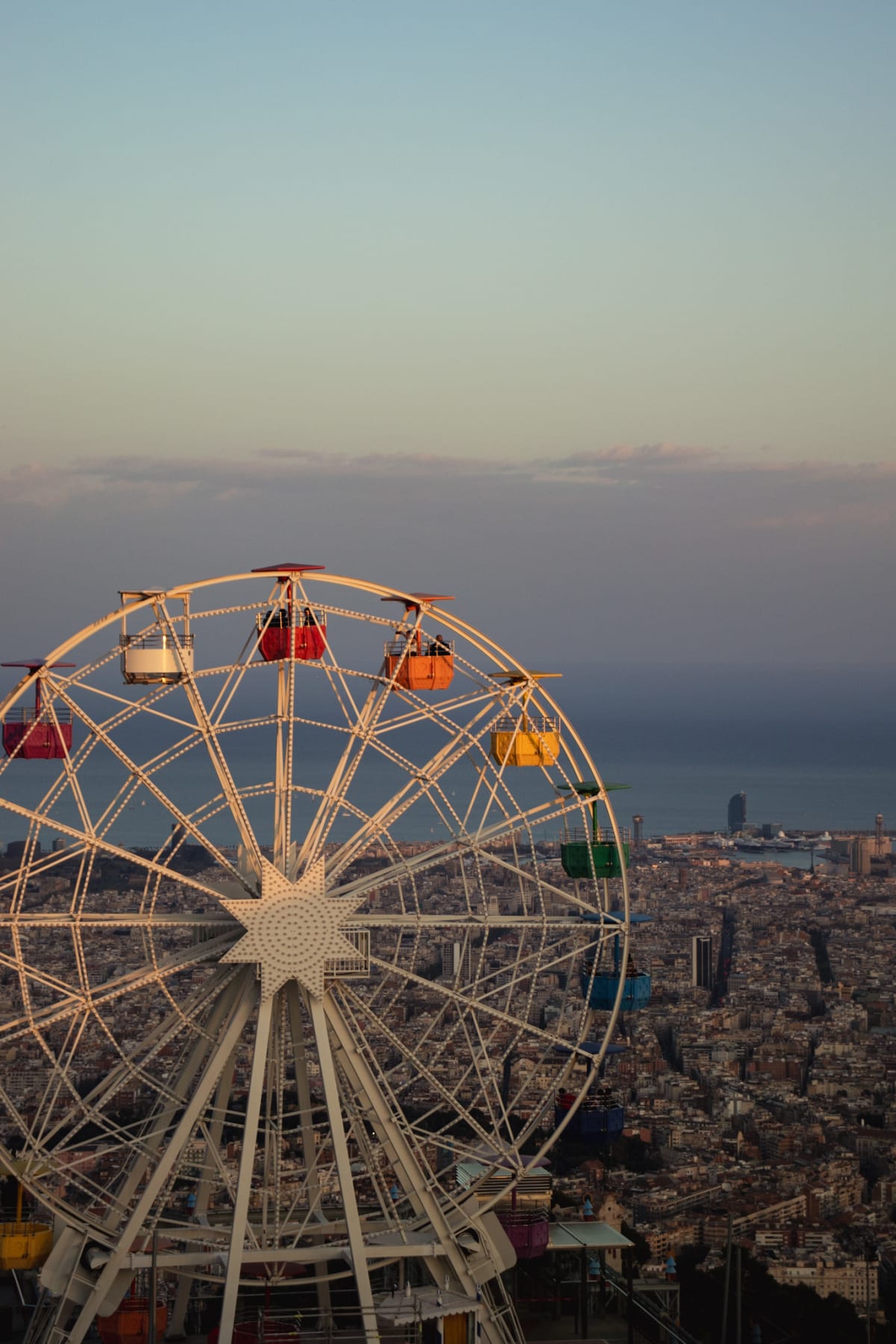 A Ferris wheel overlooking Barcelona and the Mediterranean